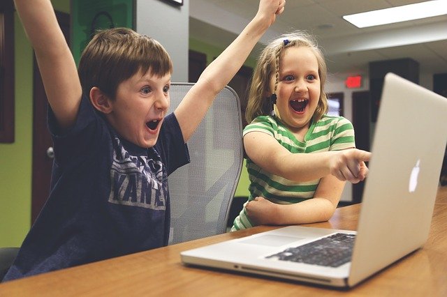 Children playing video game that teached pest control.